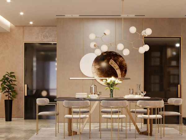 Modern dining room with gold accents, sculptural light fixture, and upholstered chairs