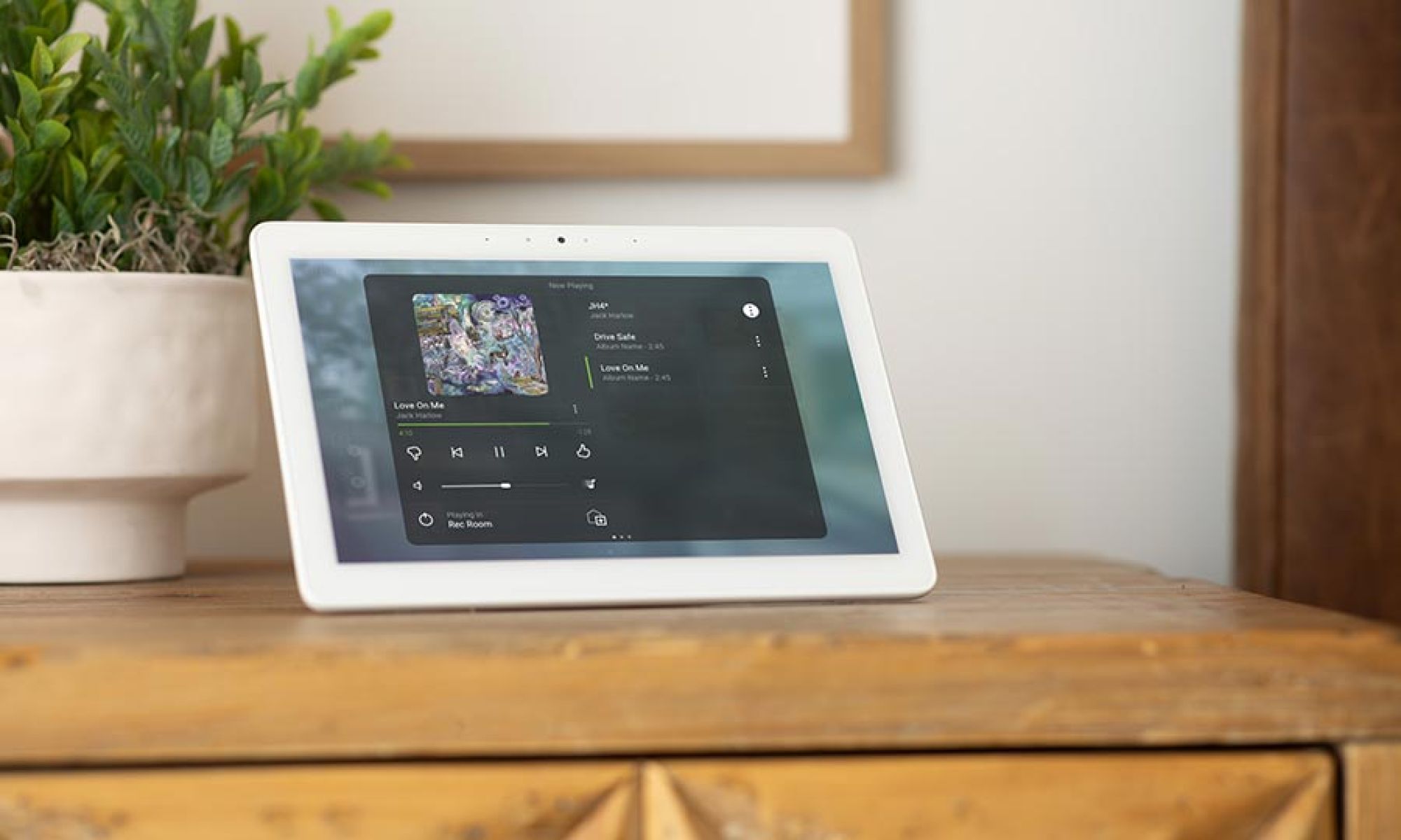 Smart home touchscreen displaying music playback controls