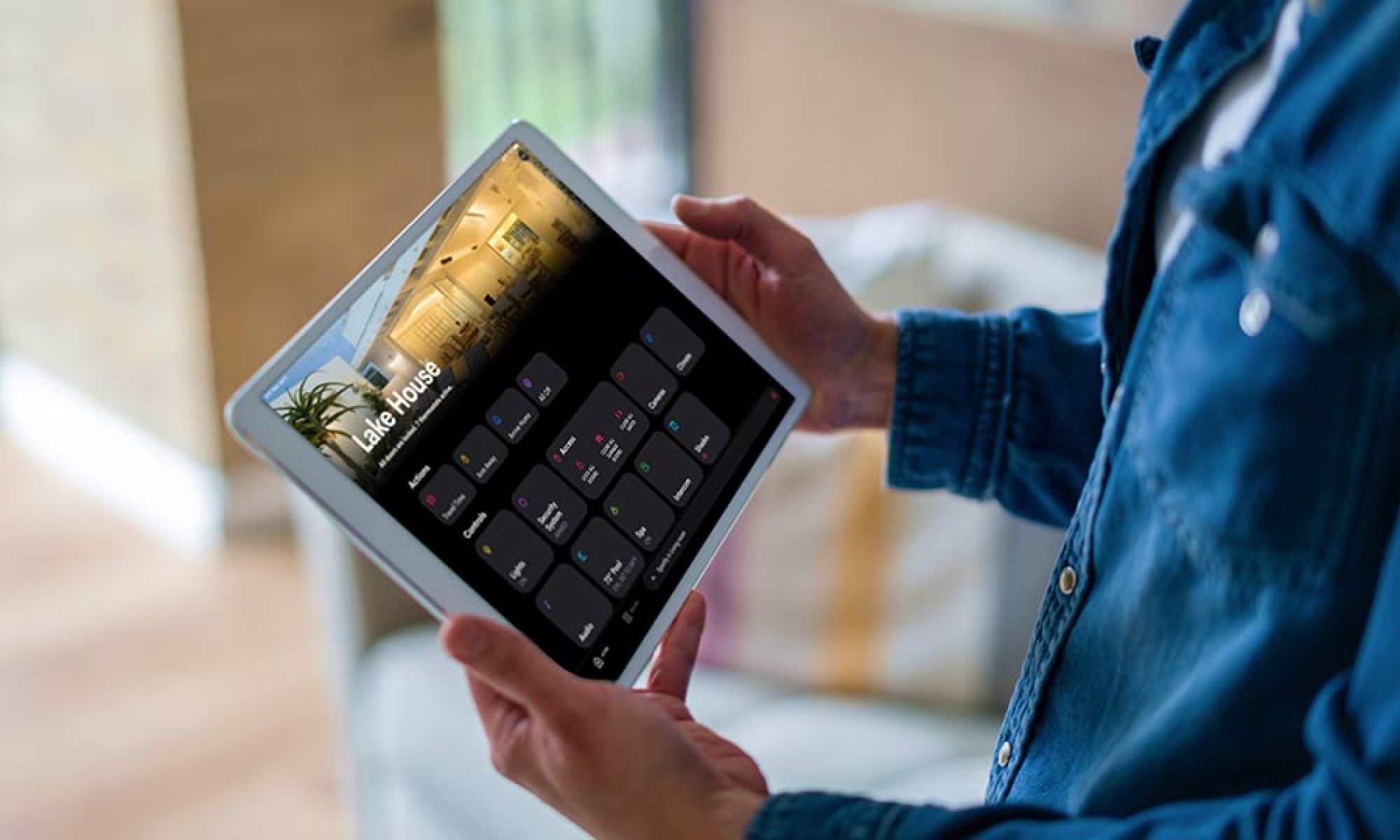 Wall mounted tablet showing whole home control interface