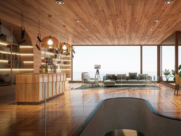Open living space with wood ceiling, bar area, bookshelves, and ocean view
